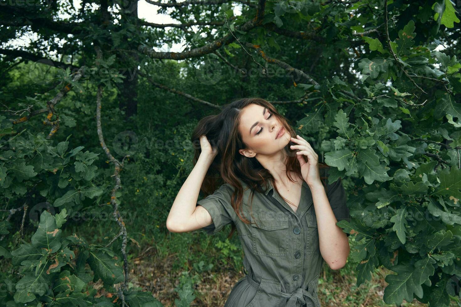 Woman outdoors Green leaves of a tree fresh air closed eyes trees photo