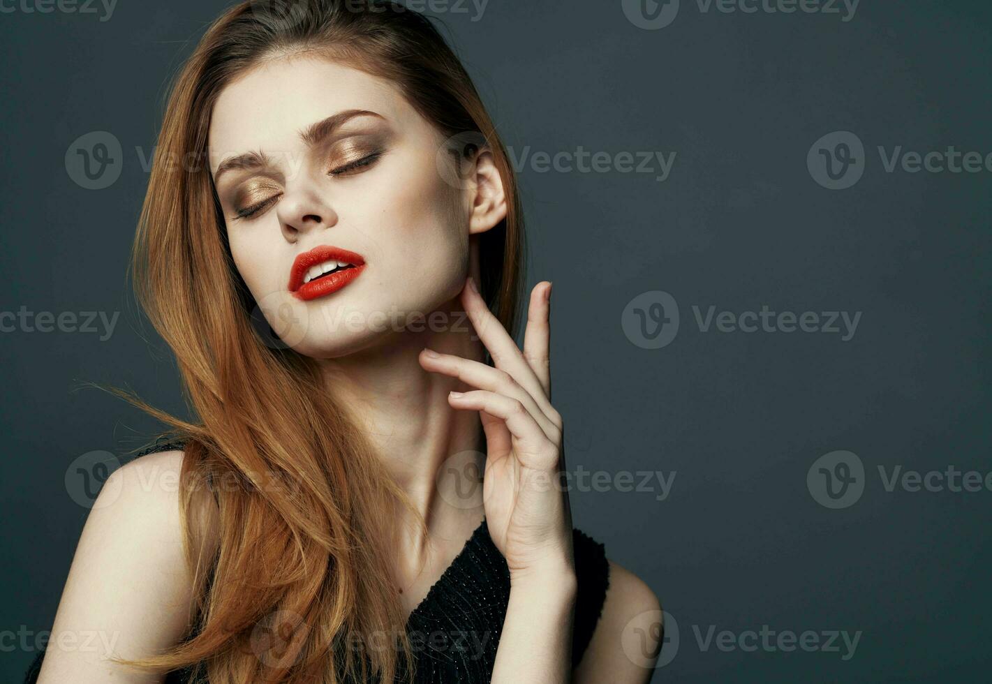 Portrait of beautiful woman with red lips makeup model gray background photo