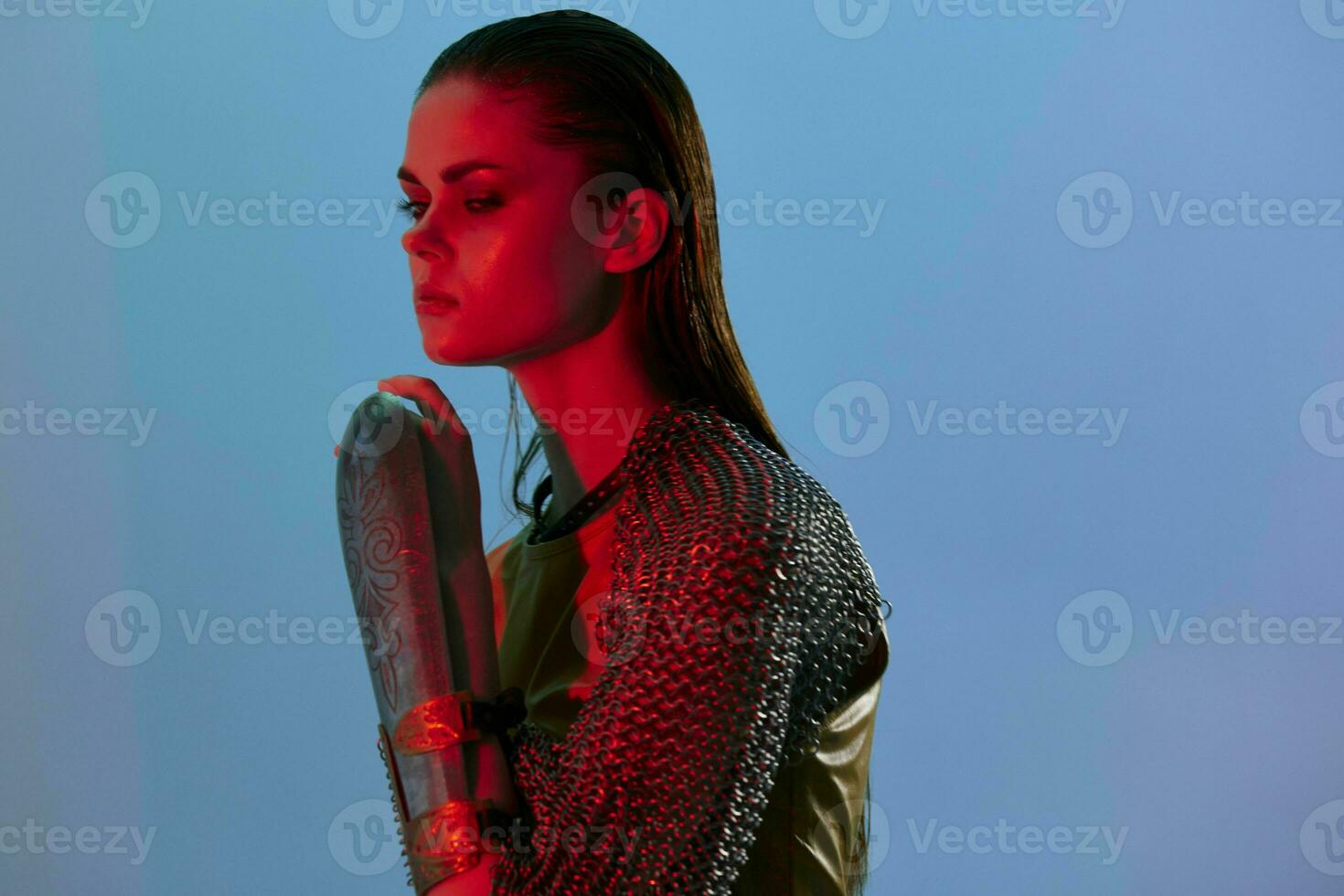 young woman red light silver armor chain mail fashion isolated background photo