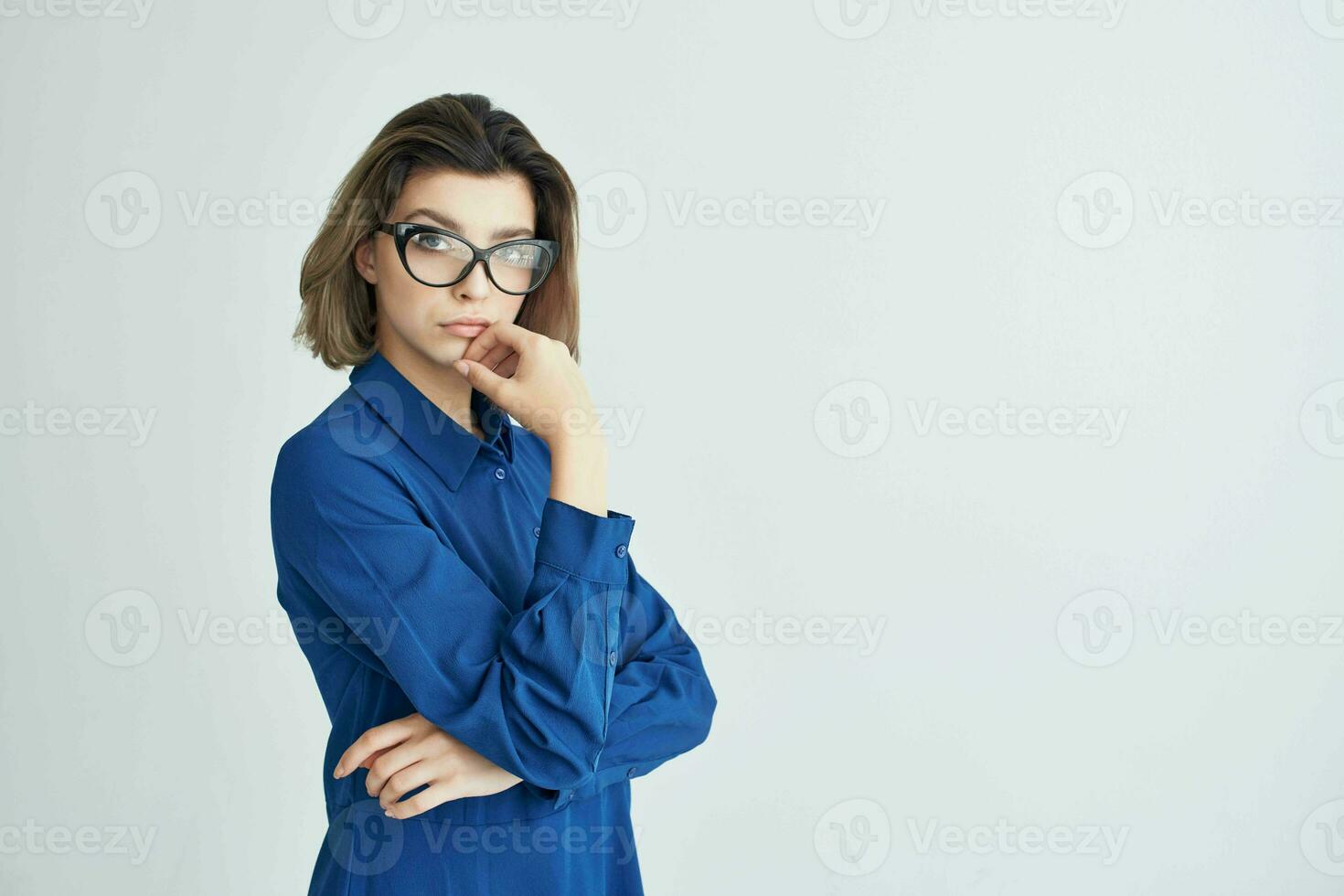 woman in blue shirt wearing glasses cropped view elegant style photo