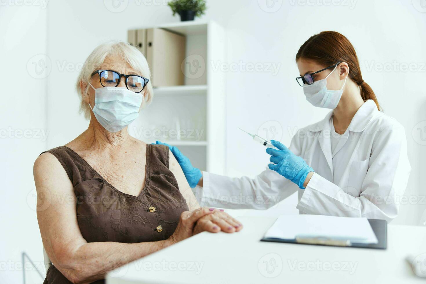 doctor with a syringe makes an injection in the arm immunity protection covid passport photo
