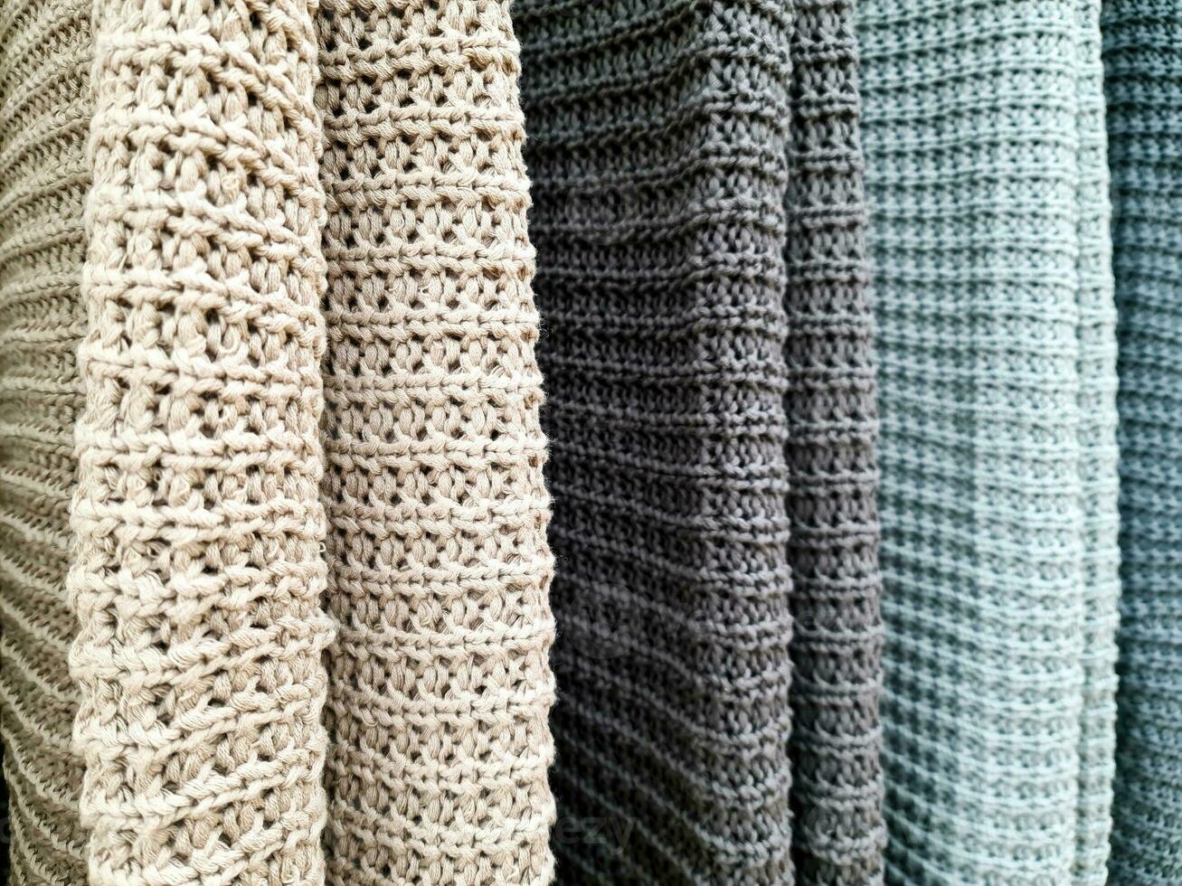 Detailed close up view on samples of cloth and fabrics in different colors found at a fabrics market photo
