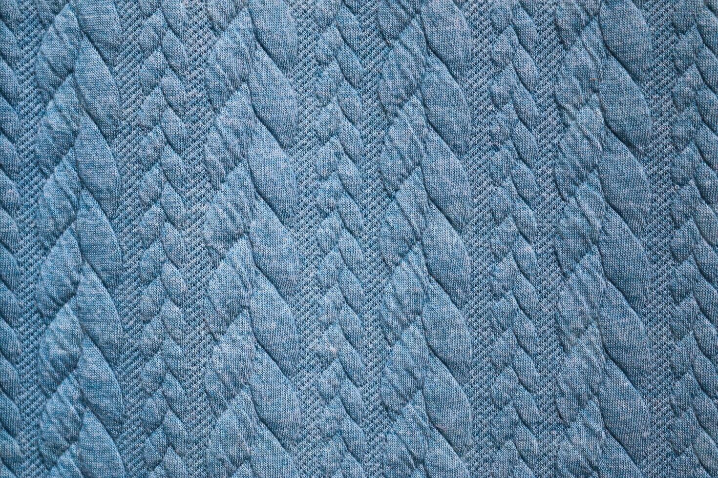 Detailed close up view on samples of cloth and fabrics in different colors found at a fabrics market photo