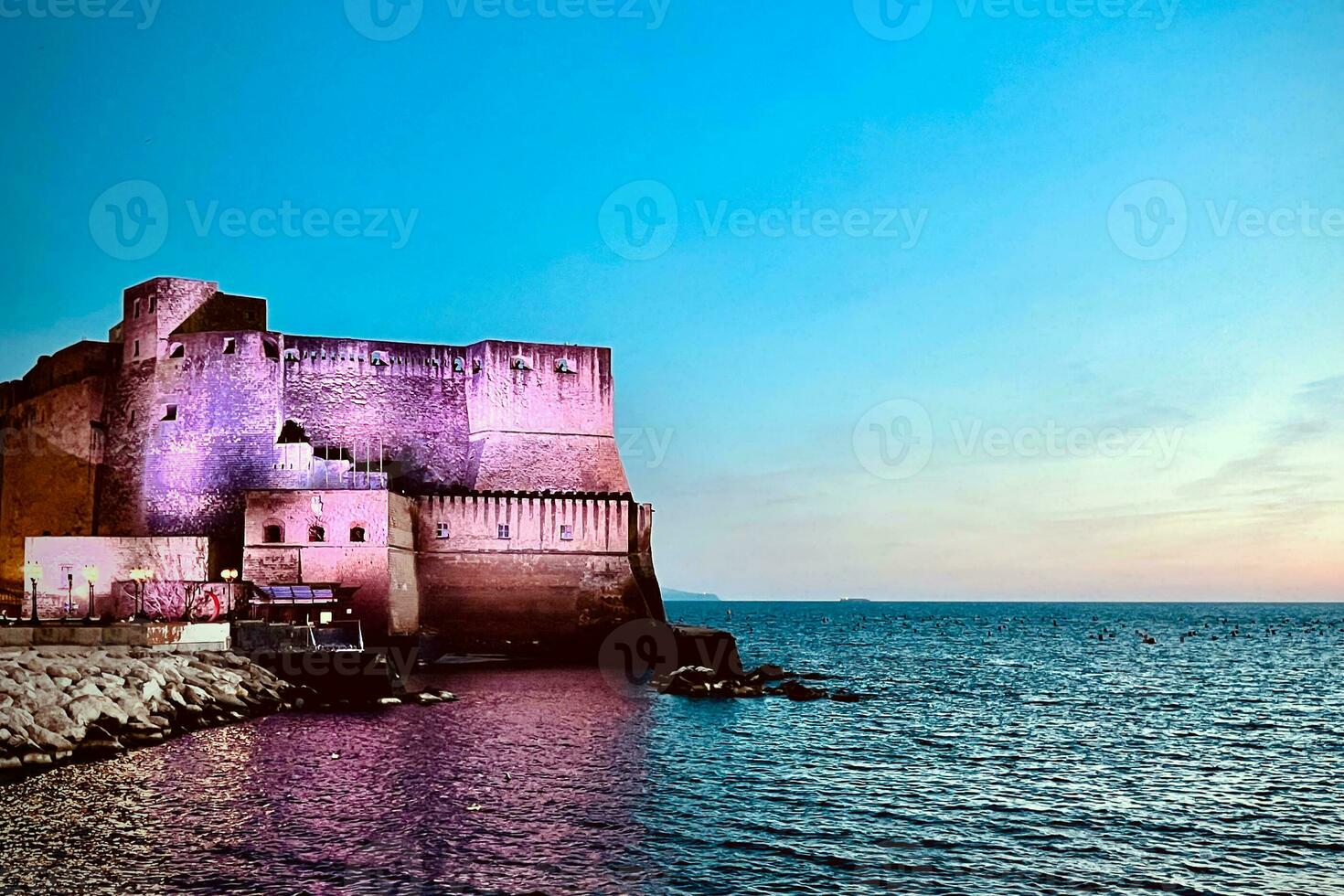 Castel dell'Ovo in Naples, at sunset photo