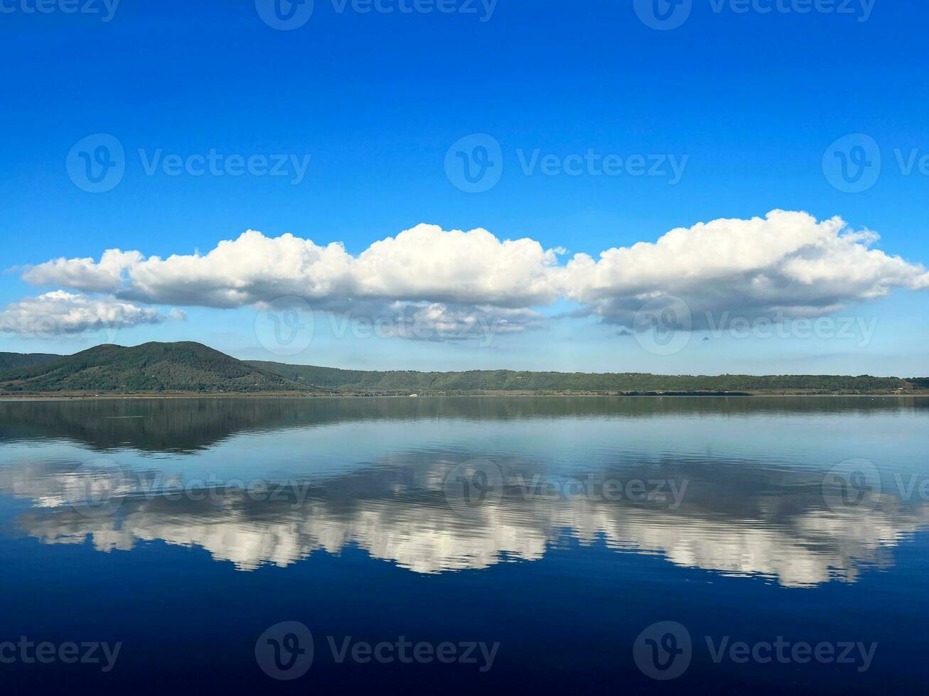Reflection of clouds on the lake photo