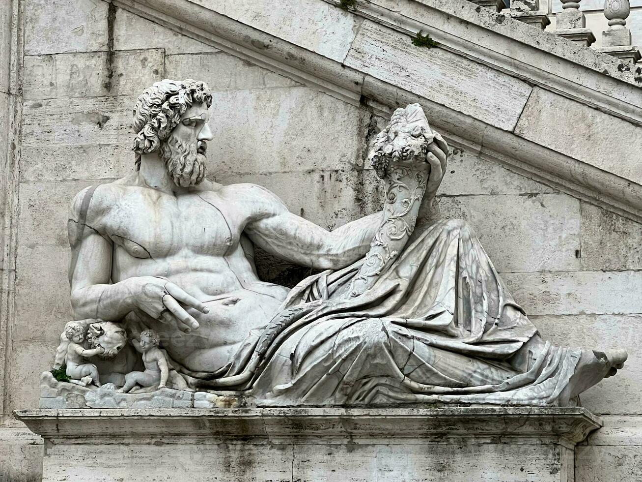 Statue of Tiberinus on the Campidoglio in Rome, Italy photo