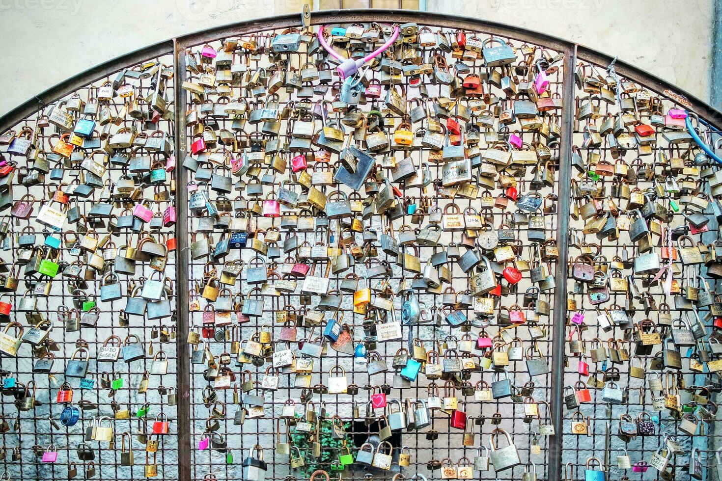 Love locks on a wall in Verona photo