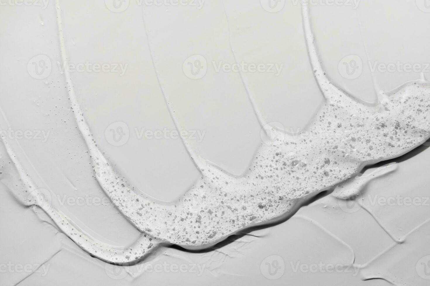 líquido gel resumen cosmético gris antecedentes. frotis de transparente hidratante producto foto