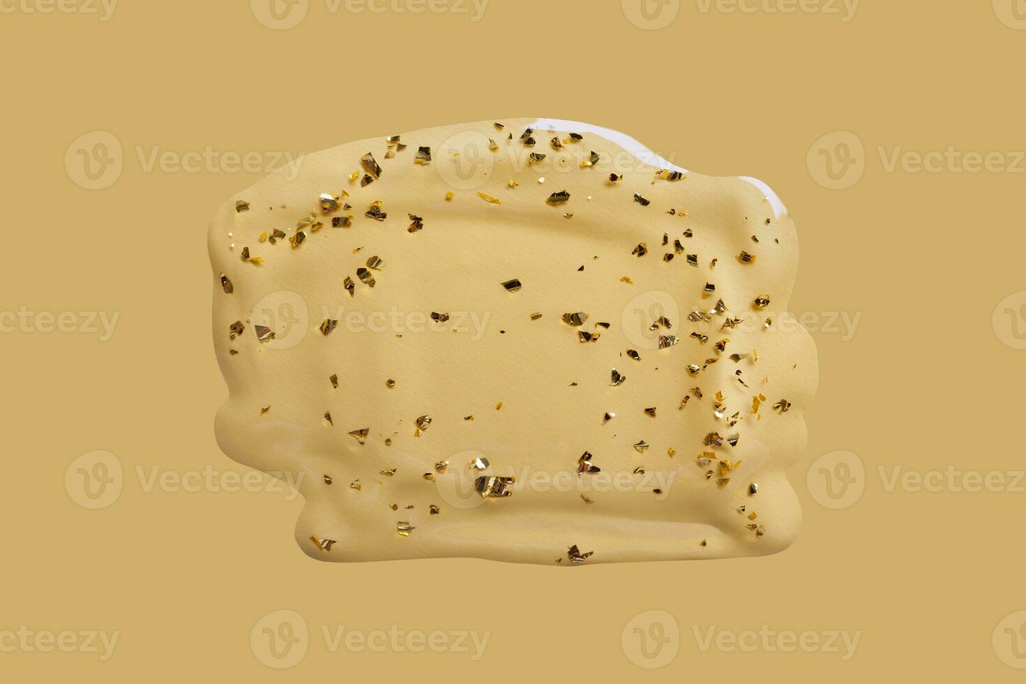 Liquid cosmetic gel swatch with gold particles on beige background. Anti-Aging Serum Sample photo