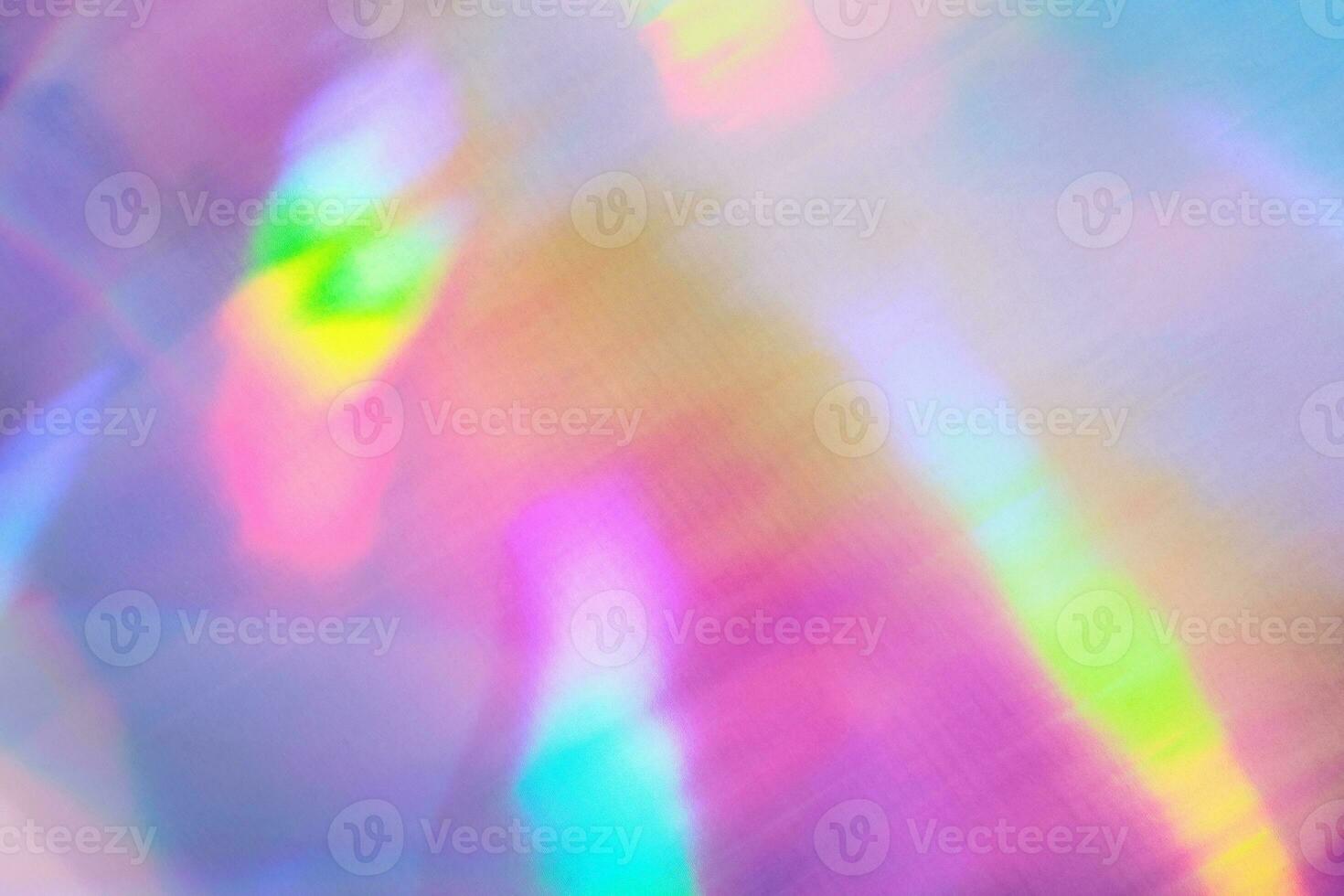 Iridescent holographic textural Background. Metallic paper or foil with iridescent highlights photo