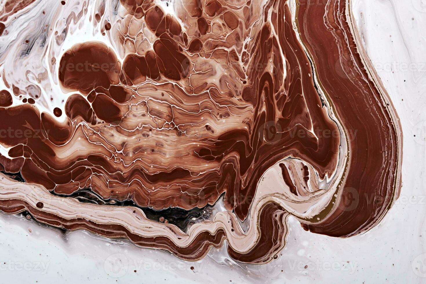 Acrylic Fluid Art. Brown waves and stains on white flowing paint. Abstract marble background or texture photo
