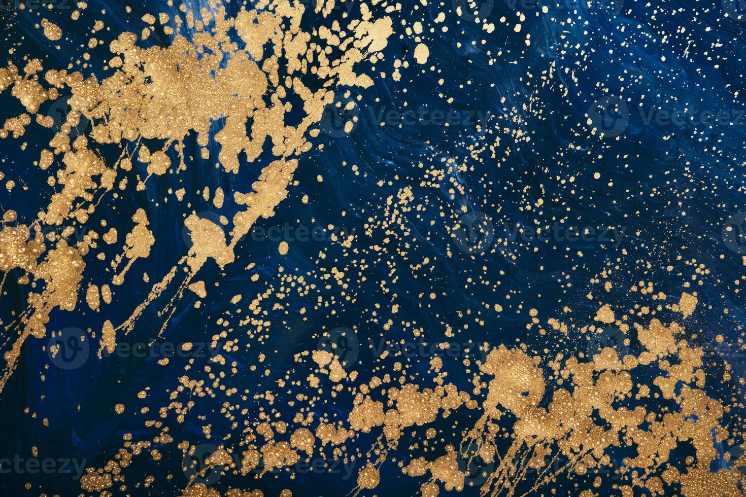 Fluid Art acrylic paints. Abstract mixing blue navi paint waves. Liquid golden flows splashes. Marble effect background or texture photo