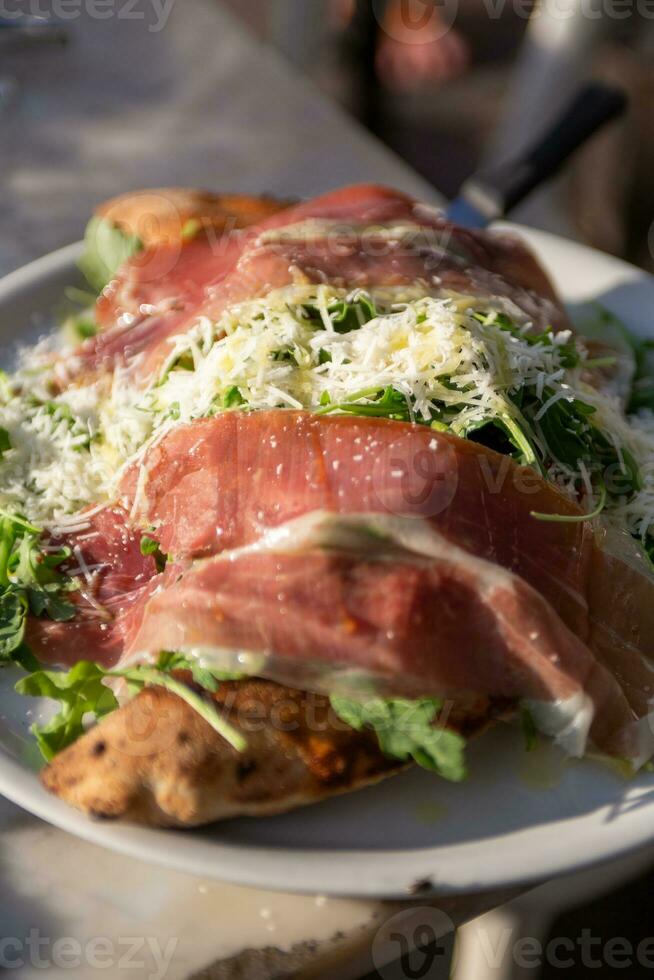Proscuitto Calzone on a plate photo