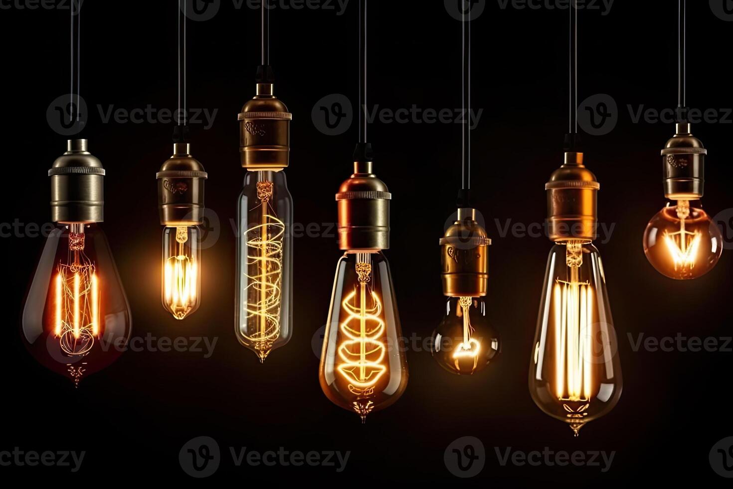 Set of vintage glowing light bulbs on dark background. photo