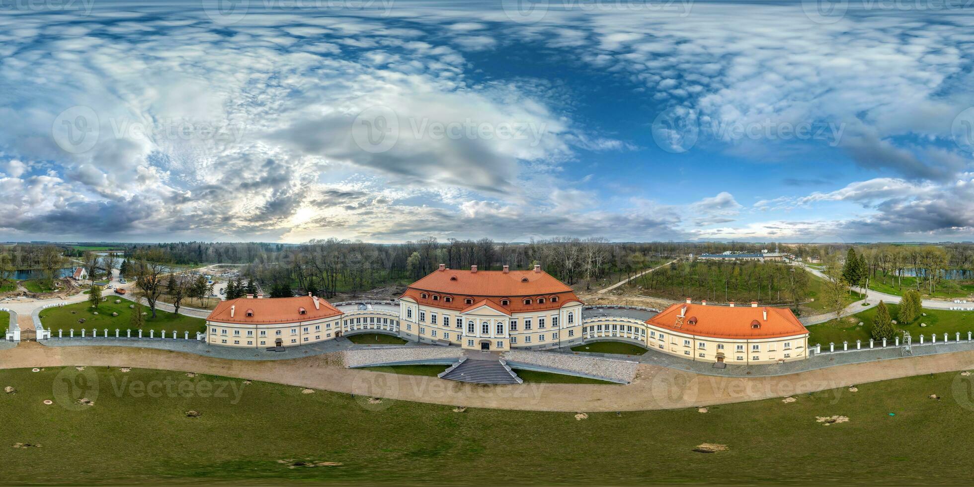 aerial seamless spherical 360 panorama overlooking restoration of the historic castle or palace near lake in equirectangular projection photo