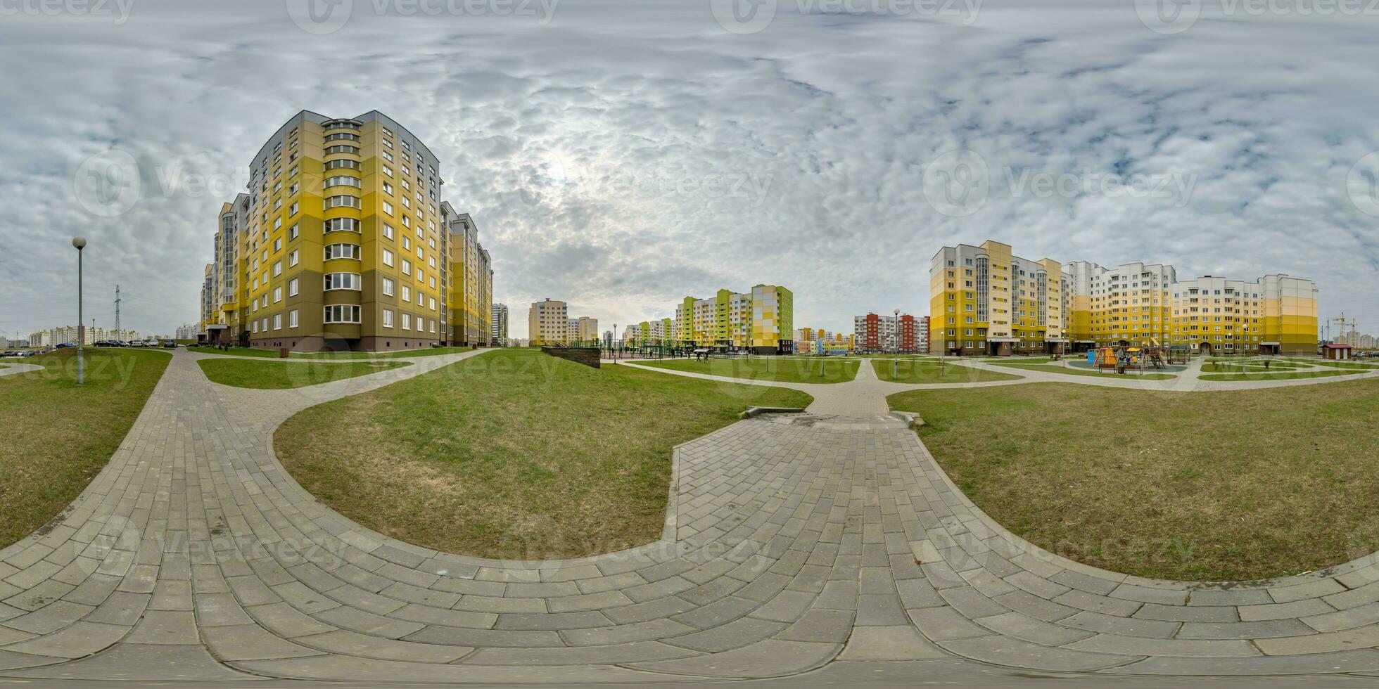 360 hdri panorama view with skyscrapers in new modern residential complex with high-rise buildings in townwith overcast sky in equirectangular spherical projection, ready AR VR virtual reality content photo