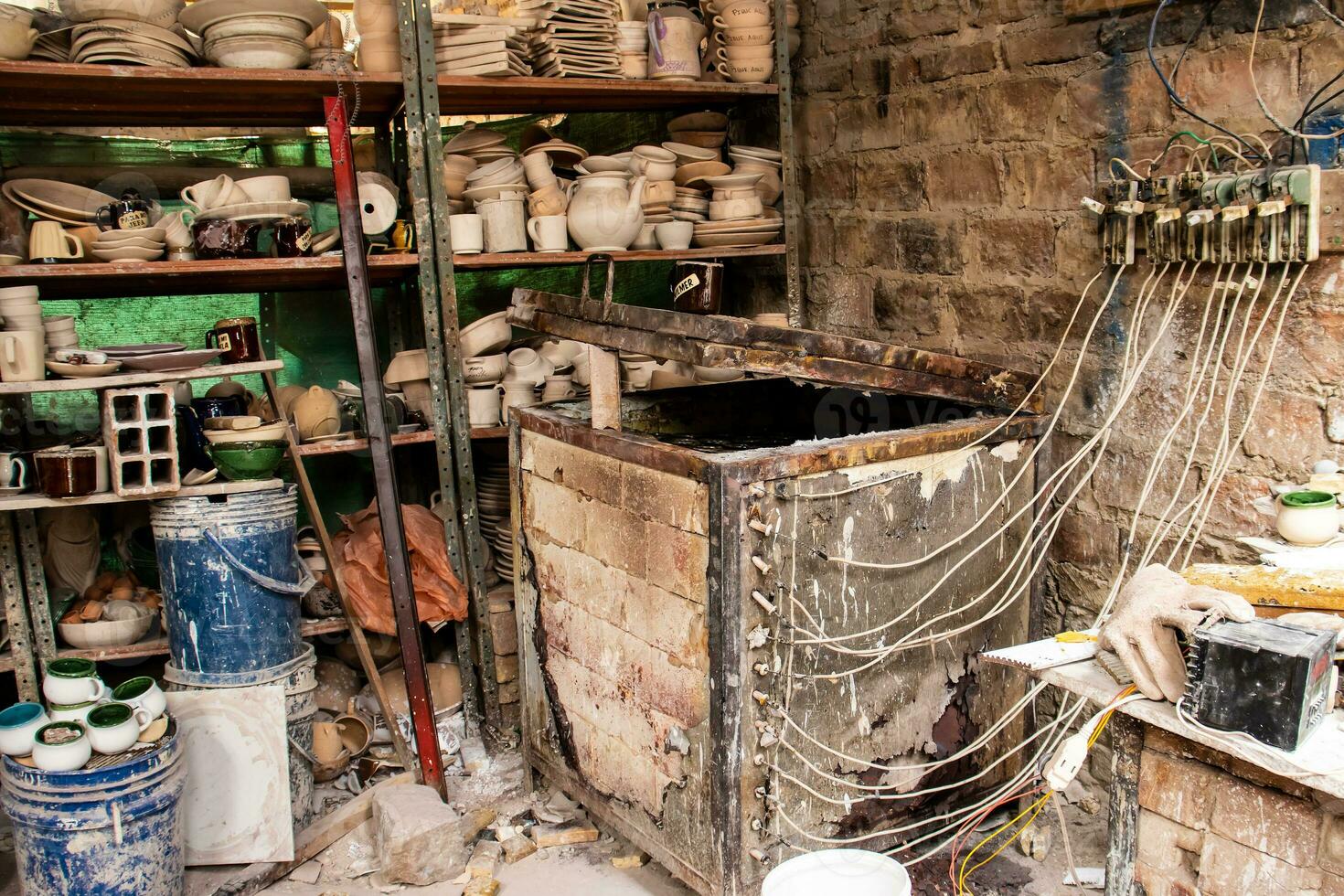 Ceramics on the elaboration process at a traditional factory at the small city of Raquira in Colombia photo