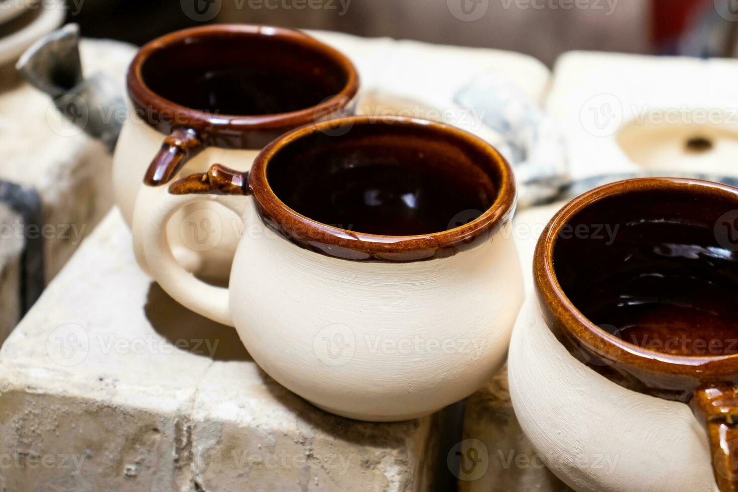 Clay injection molding technique in a traditional ceramics factory at the small city of Raquira in Colombia photo