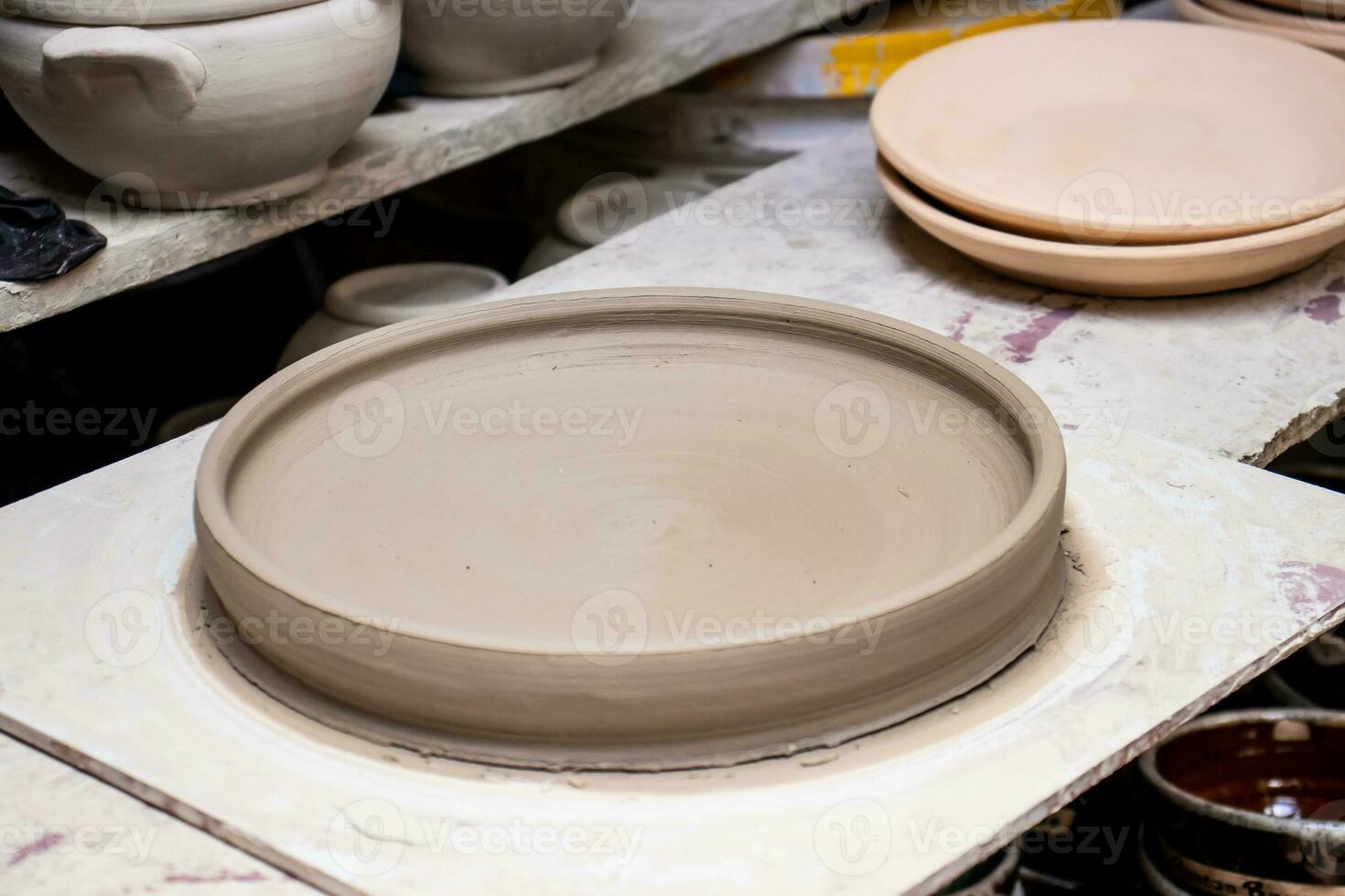 Ceramics on the elaboration process at a traditional factory at the small city of Raquira in Colombia photo