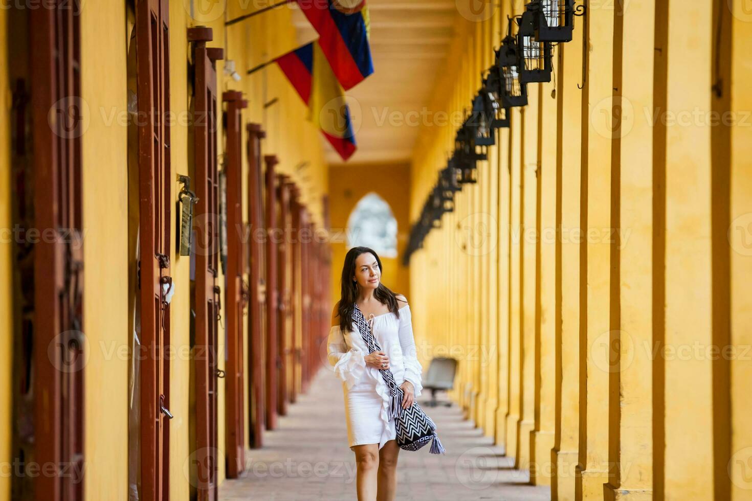 Beautiful woman walking around the walled city in Cartagena de Indias photo