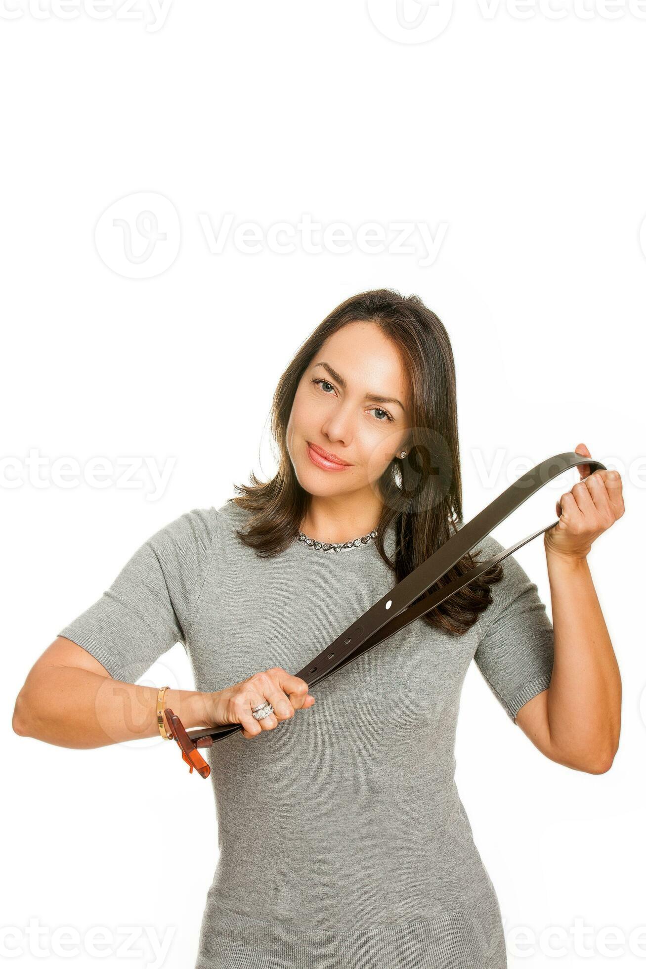 Aggressive woman with whip Stock Photo