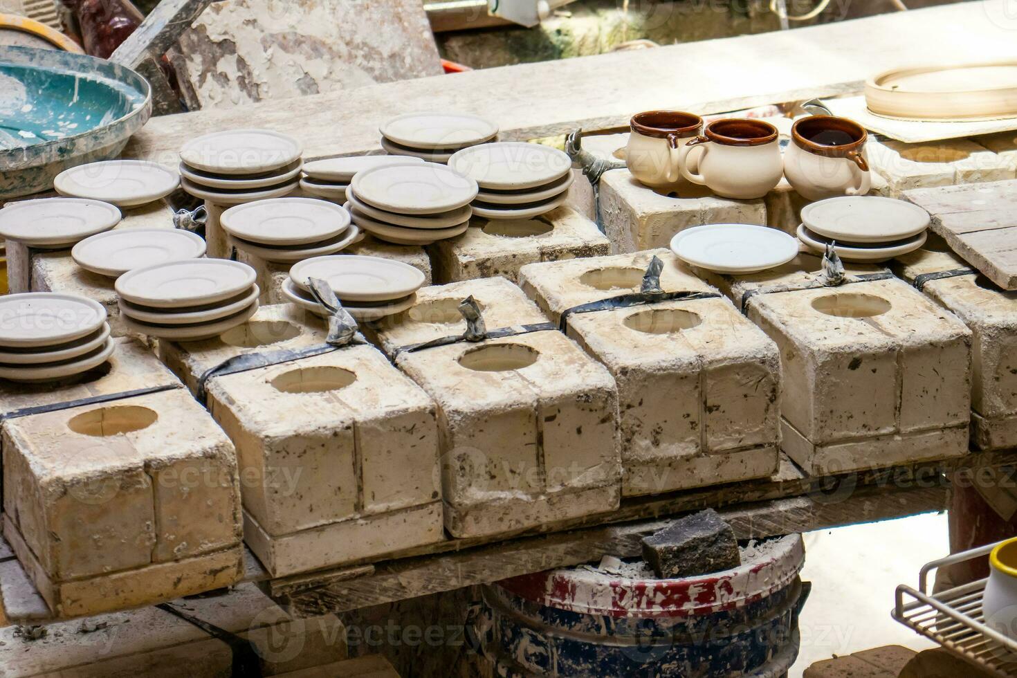 Clay injection molding technique in a traditional ceramics factory at the small city of Raquira in Colombia photo