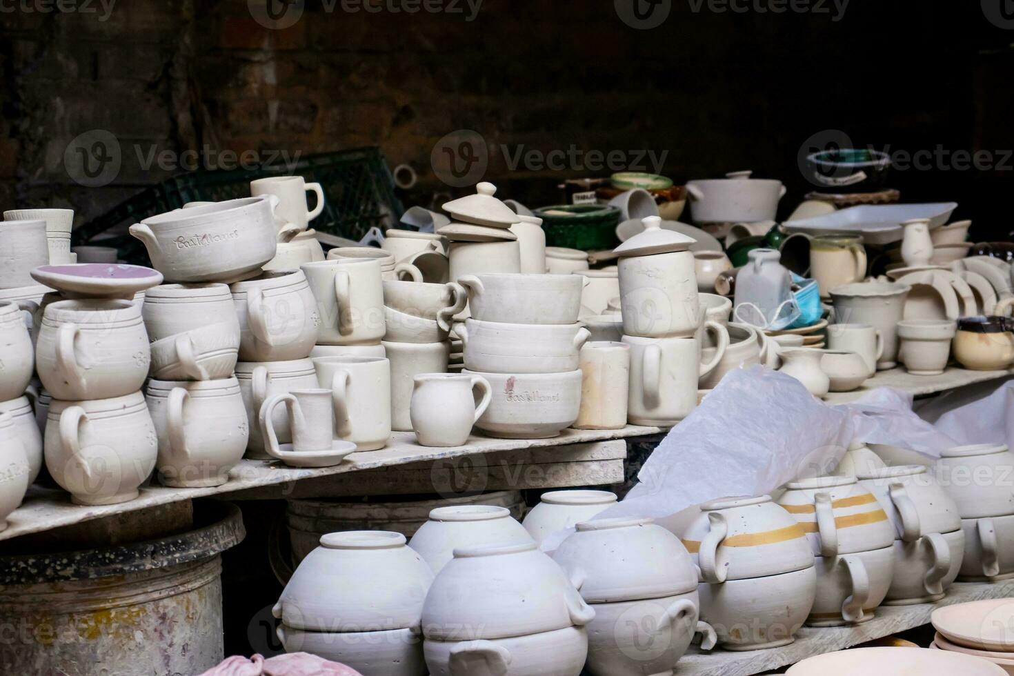 Ceramics on the elaboration process at a traditional factory at the small city of Raquira in Colombia photo