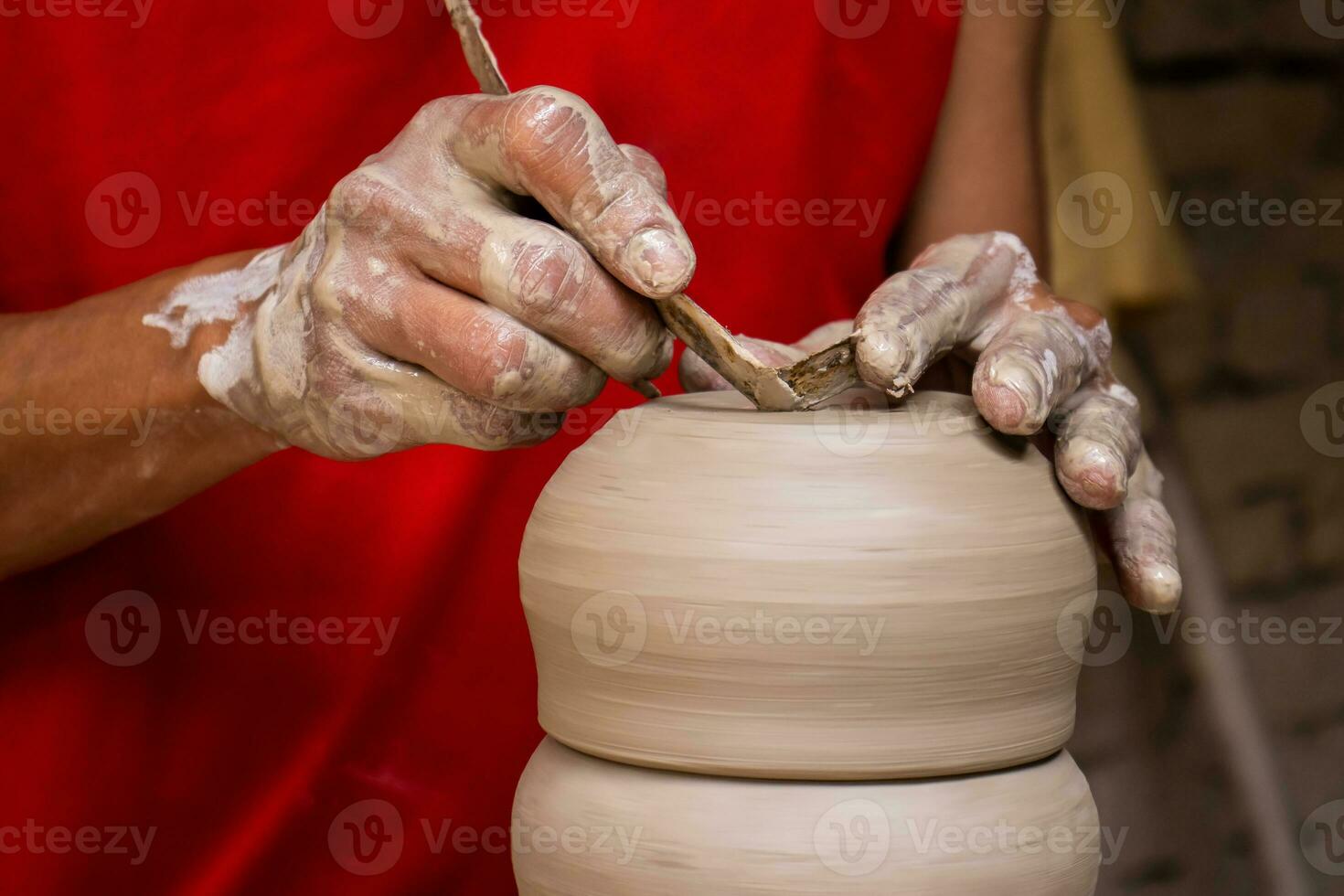 Ceramics on the elaboration process at a traditional factory at the small city of Raquira in Colombia photo