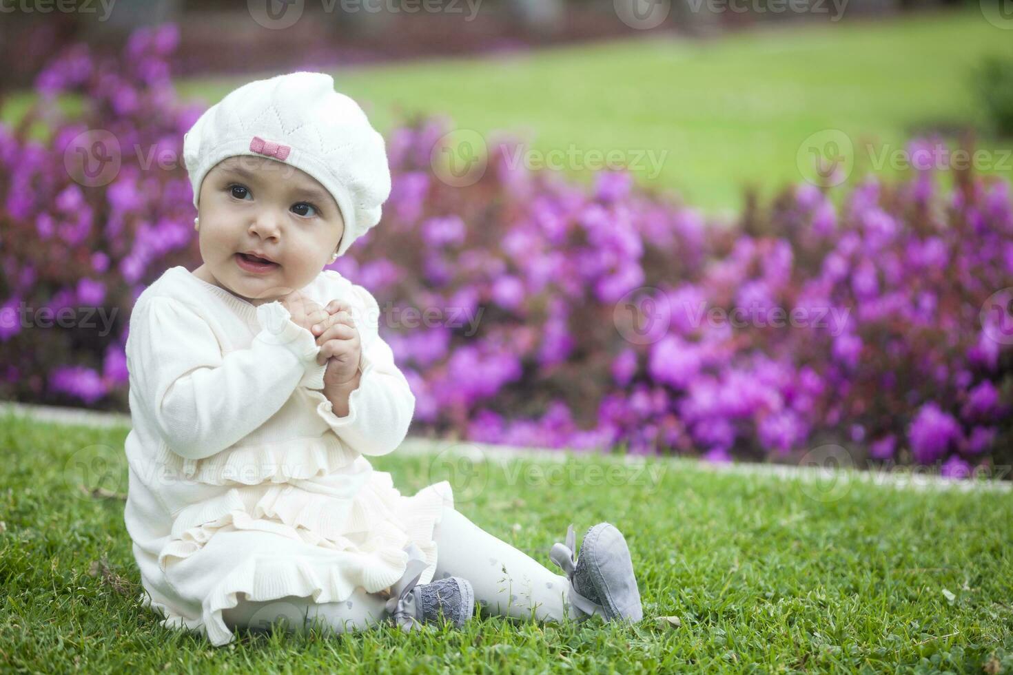 Baby girl at the garden photo