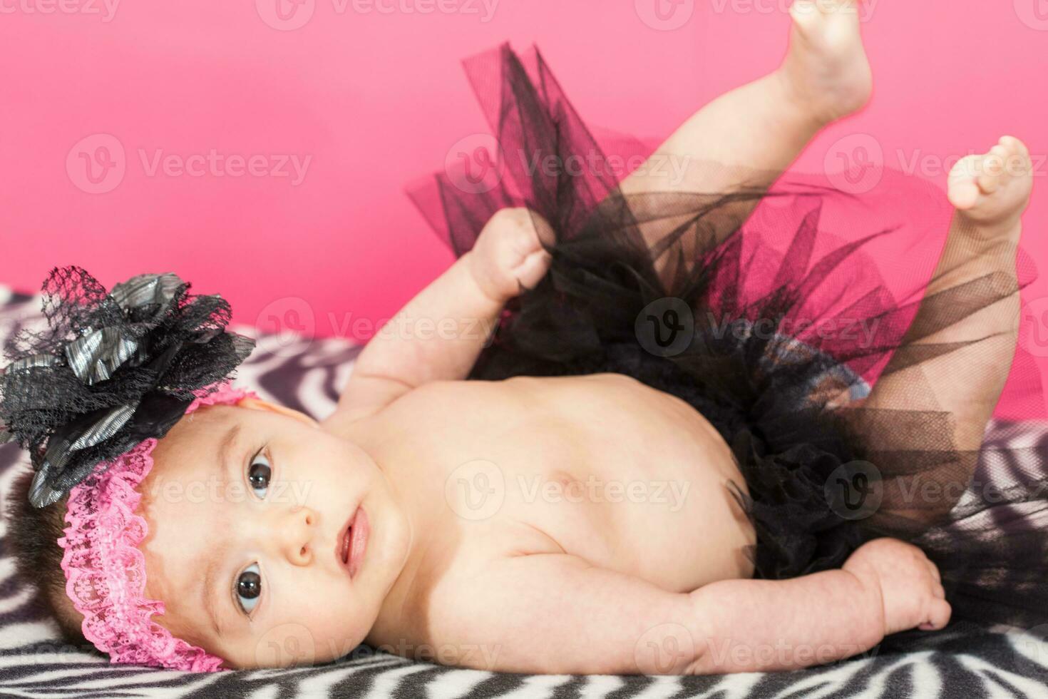 Four months old baby girl wearing a black tutu photo