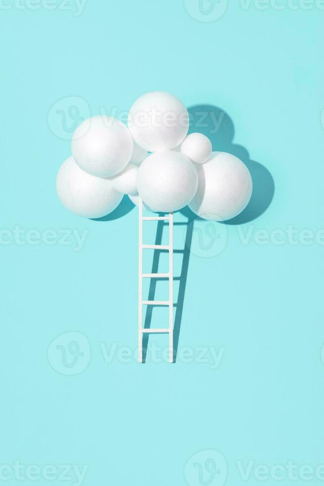 Ladder to the clouds idea, minimal creative inspirational layout, pastel blue background. photo
