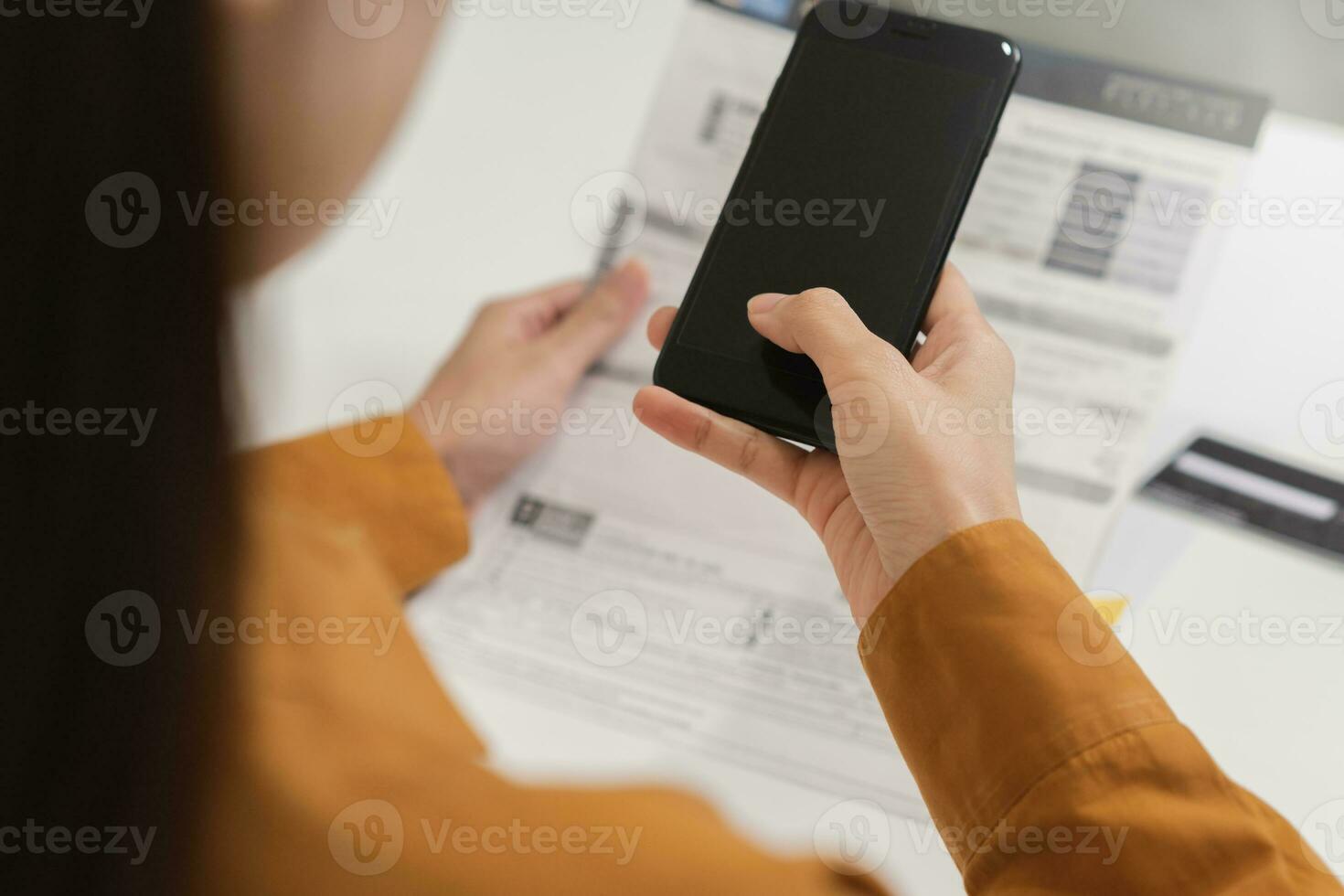 Convenience online internet banking, asian young woman hand in payment bill, spending by scan qr code, use phone, mobile to transfer or pay money of credit card without cash. Technology of financial. photo