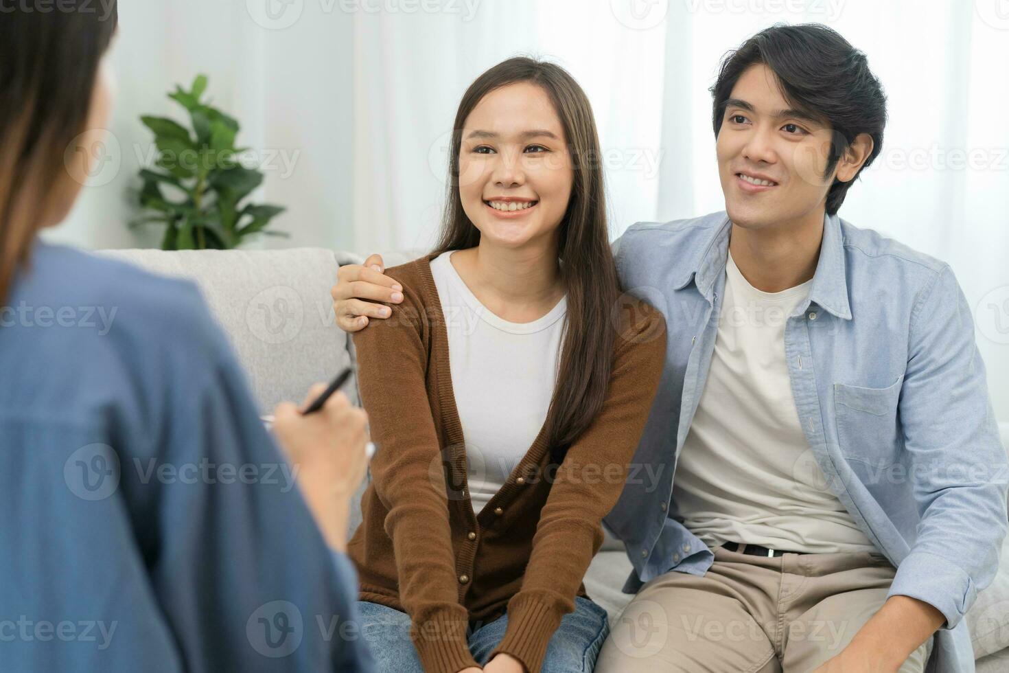 Psychology, depression asian young couple love, patient consulting problem mental health with psychologist, psychiatrist at clinic together, husband embracing shoulder of wife, therapy health care. photo