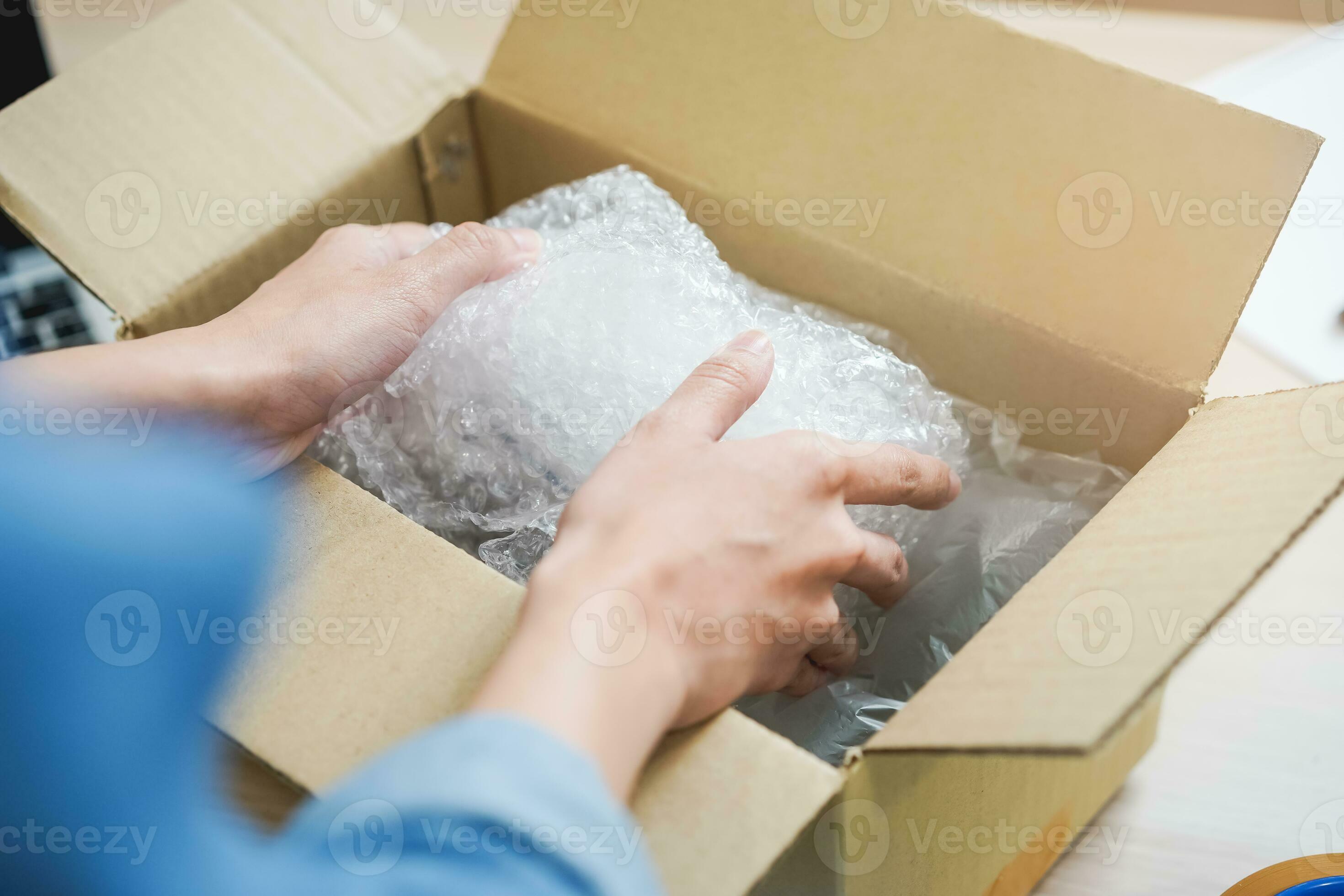 Small business entrepreneur SME, hand of woman owner packing product