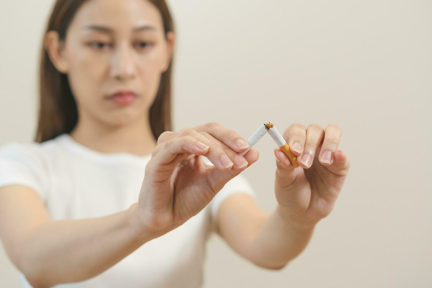 Quit, stop smoking, addiction asian young woman, girl refusing cigarette, smoker quitting smoke, hand in broken, break tobacco. Quit bad habit, health care concept. Willpower lifestyle of people. photo