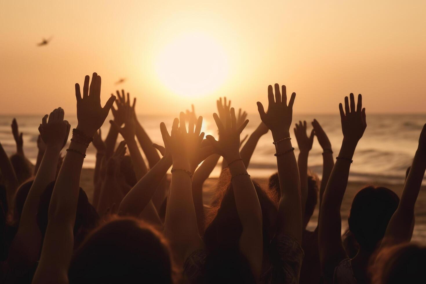 Cheering crowd with hands in the air, summer vacation image, Bokeh People have fun at sunset on a beach, photo