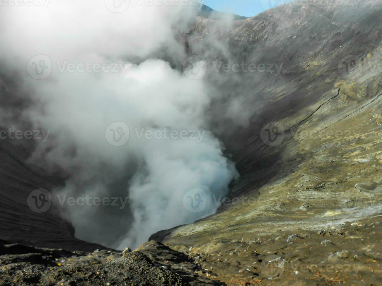 Volcano crater spewing smoke activity at Mount Bromo Tengger Semeru National park photo