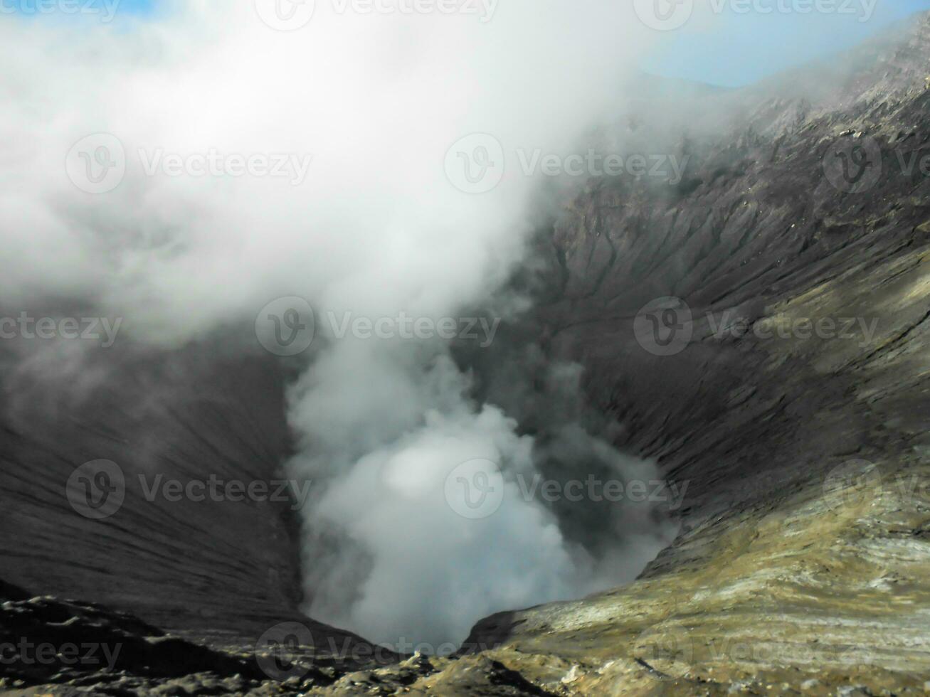 Close up of volcano crater spewing smoke at Mount Bromo photo