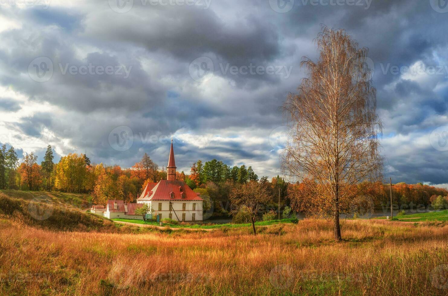 Panoramic view of the beautiful natural landscape. Old castle, blue sky and white fluffy clouds at the sunny summer day. Gatchina. Russia. photo