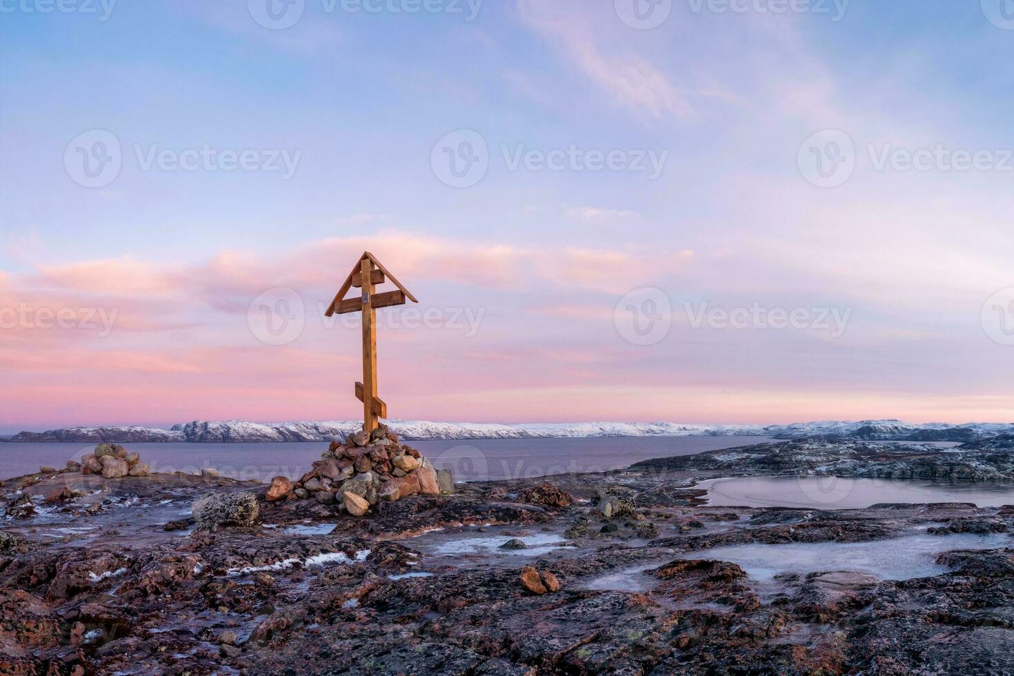 Cross on the Kola Peninsula, cold dawn in Teriberka photo