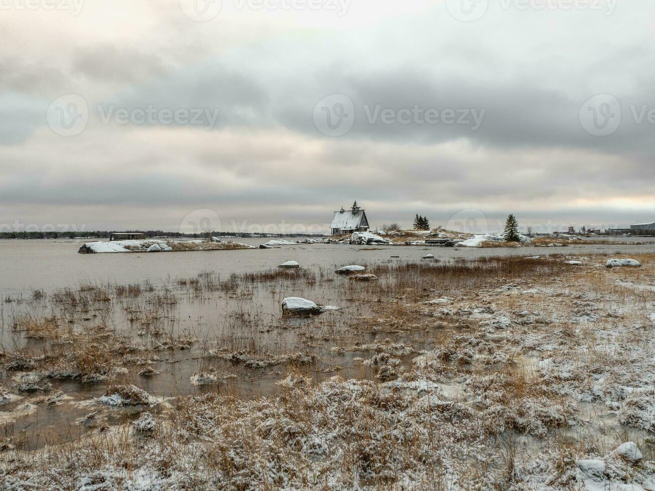 View of the island with a wooden old fishing lodge. photo