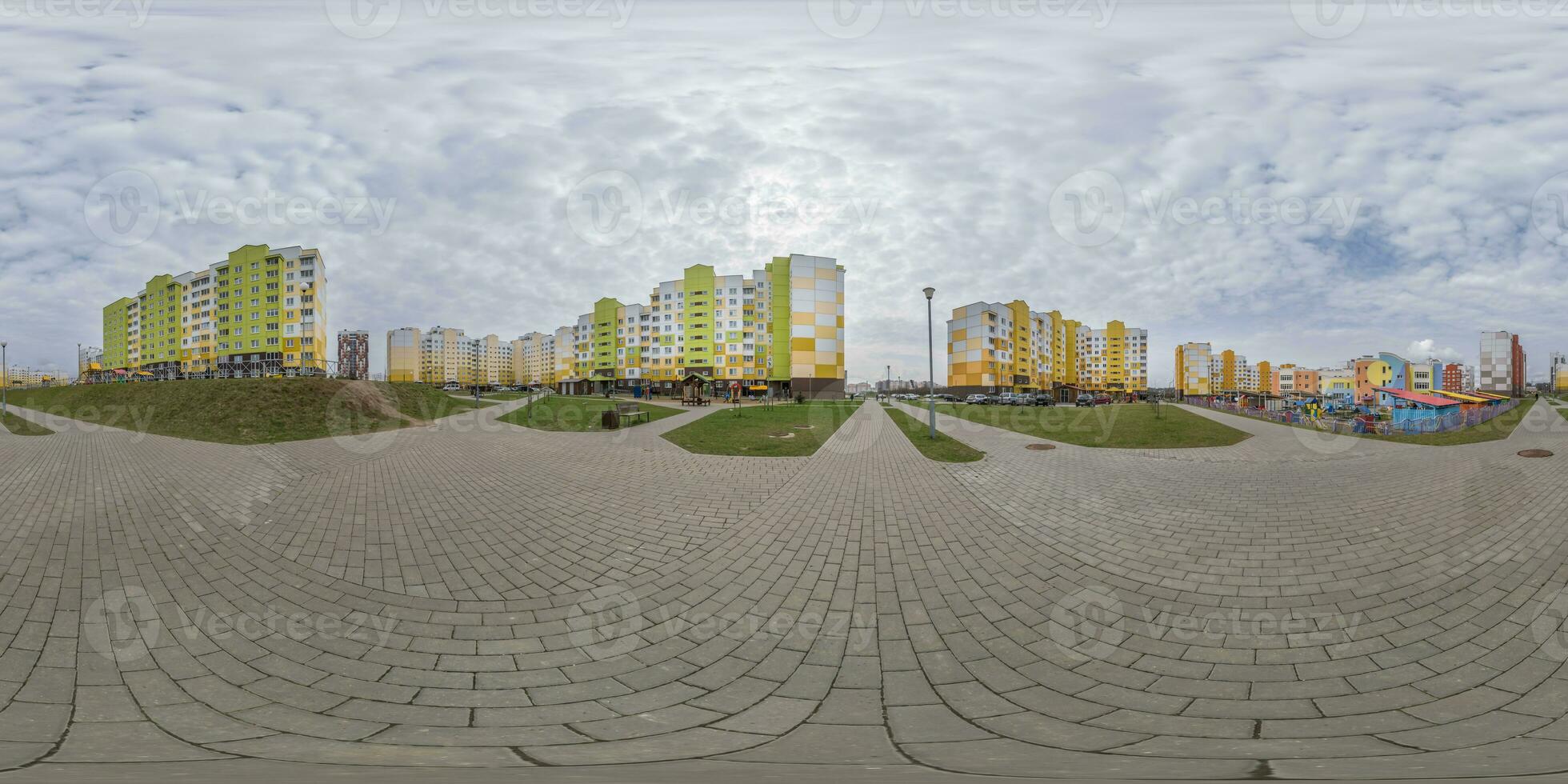 360 hdri panorama view with skyscrapers in new modern residential complex with high-rise buildings in town with overcast sky in equirectangular spherical projection, ready VR virtual reality content photo