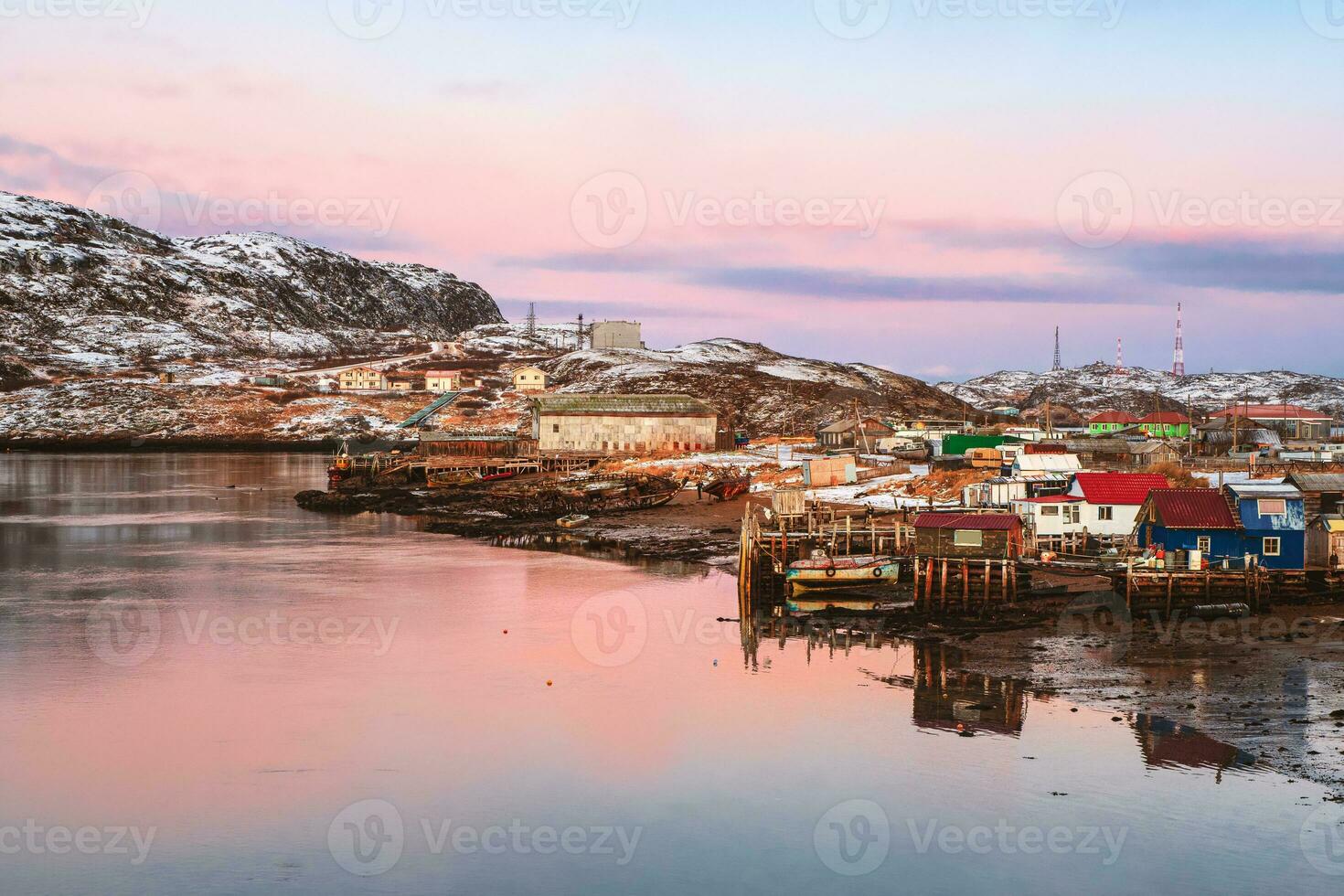 Arctic village on the shore of the Barents sea. Amazing view of winter Teriberka. photo