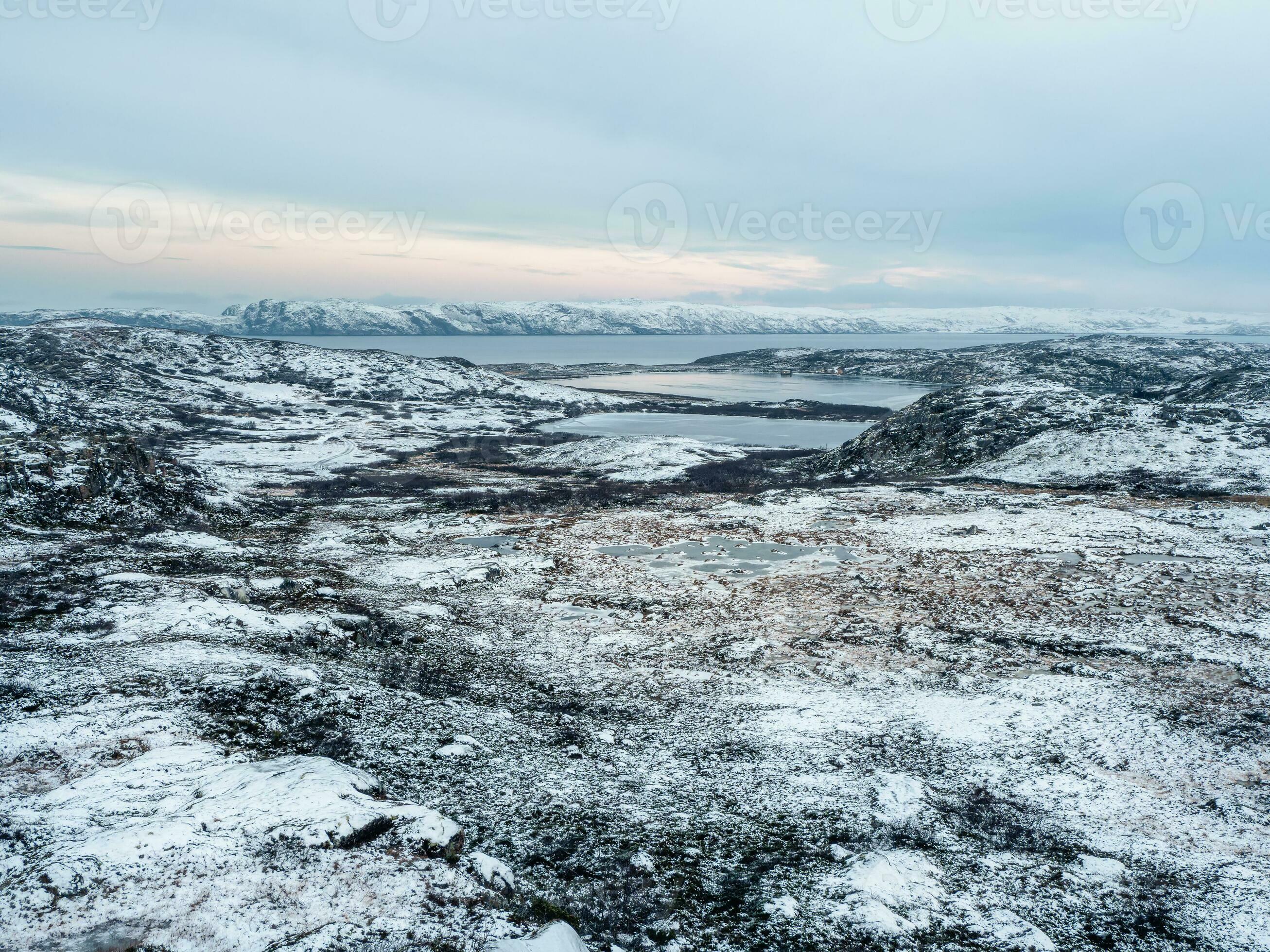 Amazing Arctic landscape with a high-altitude frozen lake. Arctic 