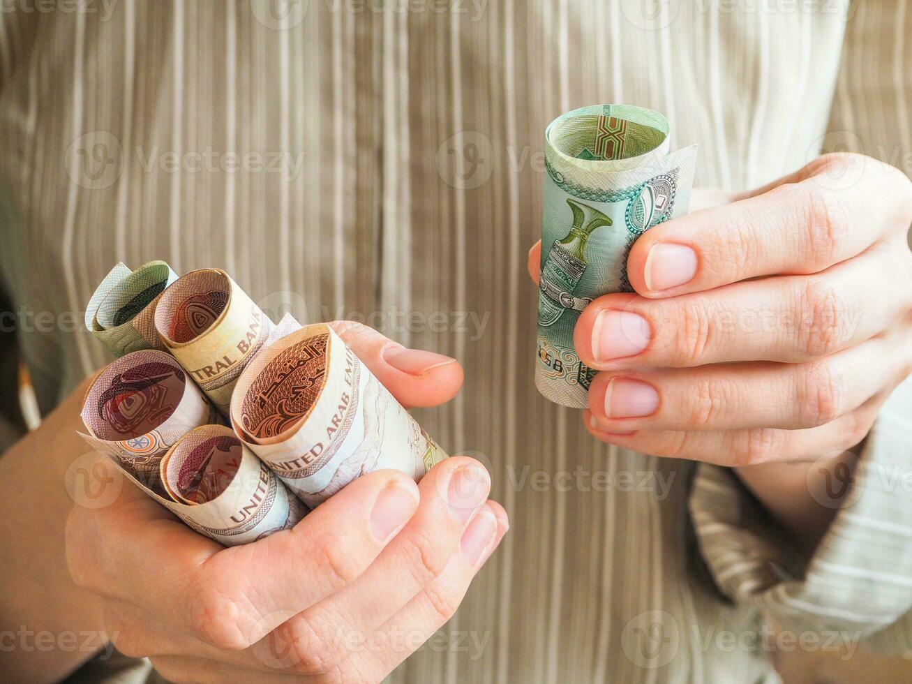 Arabic dirhams of women's hands photo