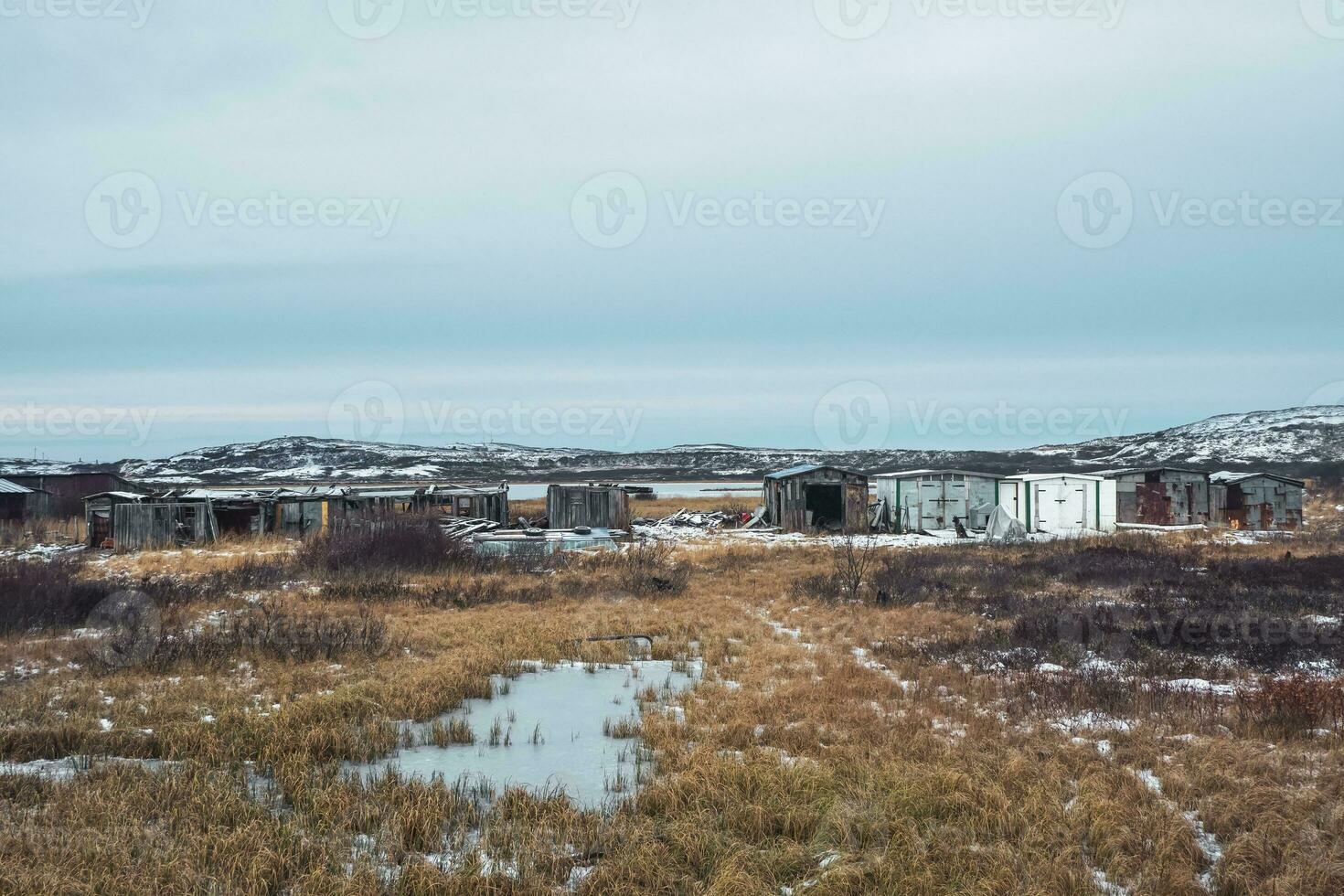 Garages in the northern Arctic village of Lodeynoye, Kola Peninsula, Russia. Panoramic view. photo