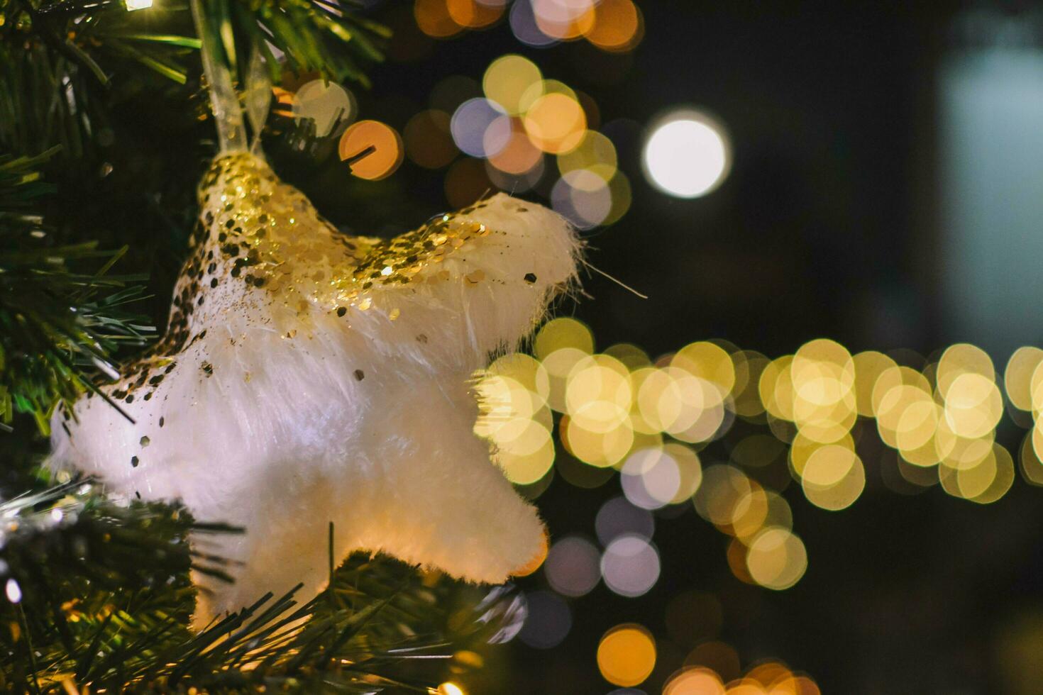 New Year's decoration with a book, a cup of tea, cookies and Christmas tree details photo