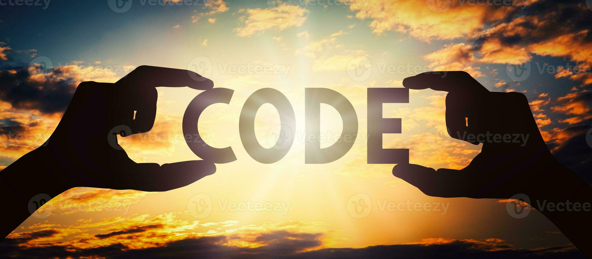 Code - Human Hands Holding Black Silhouette Word photo