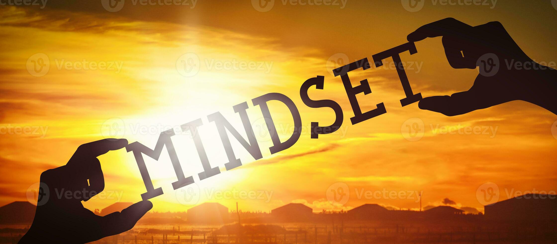 Mindset - Human Hands Holding Black Silhouette Word photo