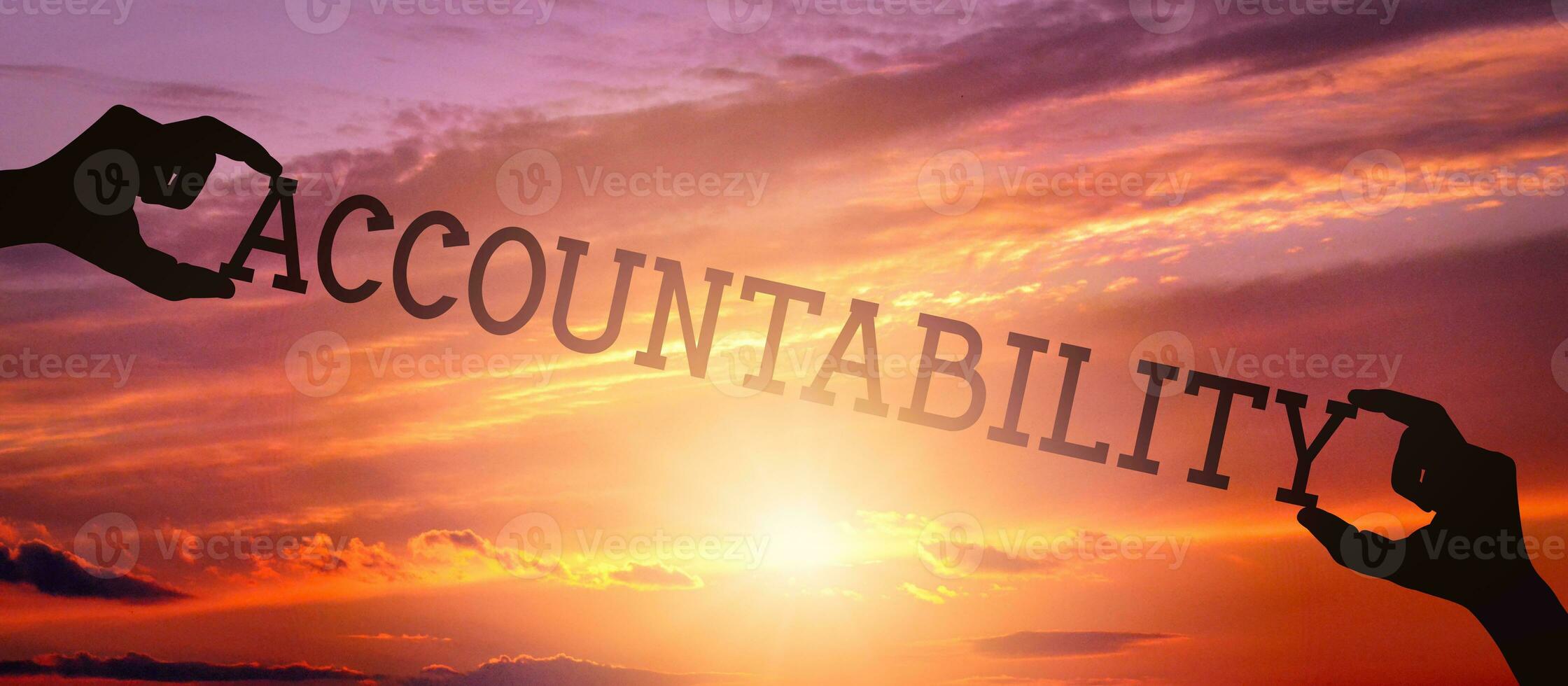 Accountability - Human Hands Holding Black Silhouette Word photo